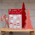 Load image into Gallery viewer, Pack of pink scented sachets with watercolor santas on it displayed on wood tray with plastic christmas tree decor and peppermints.
