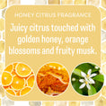Load image into Gallery viewer, A graphic for Fresh Scents Bee Happy - Sachet 3pk with text: Juicy citrus and golden honey blend with orange blossoms and fruity musk. Features images of orange slices, honey, and an orange blossom for a long-lasting air freshener.