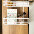 Load image into Gallery viewer, A pack of scented sachets with a floral design, labeled 'Roses', displayed in an over the door hanging organizer with makeup
