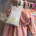 Load image into Gallery viewer, Baby Powder scented sachet in closet with kids clothes