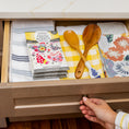 Load image into Gallery viewer, An open kitchen drawer holds folded dish towels, two wooden spoons, a yellow checkered cloth, and Fresh Scents Happy Chicken - Sachet 3pk flameless air fresheners for lasting fragrance. A hand grasps the drawer knob.