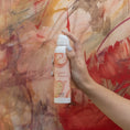Load image into Gallery viewer, Holding Summer Romance Fragrance Room Spray Against Painted Back Drop