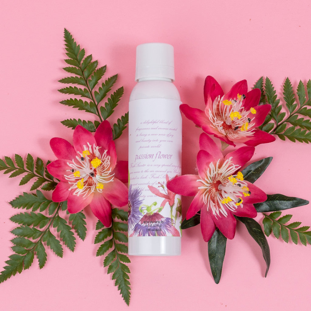 Passion Flower Room Spray Fragrance on Pink Background with Passion Flowers