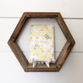 Load image into Gallery viewer, Bee Happy scented sachet sitting on hexagon shelf
