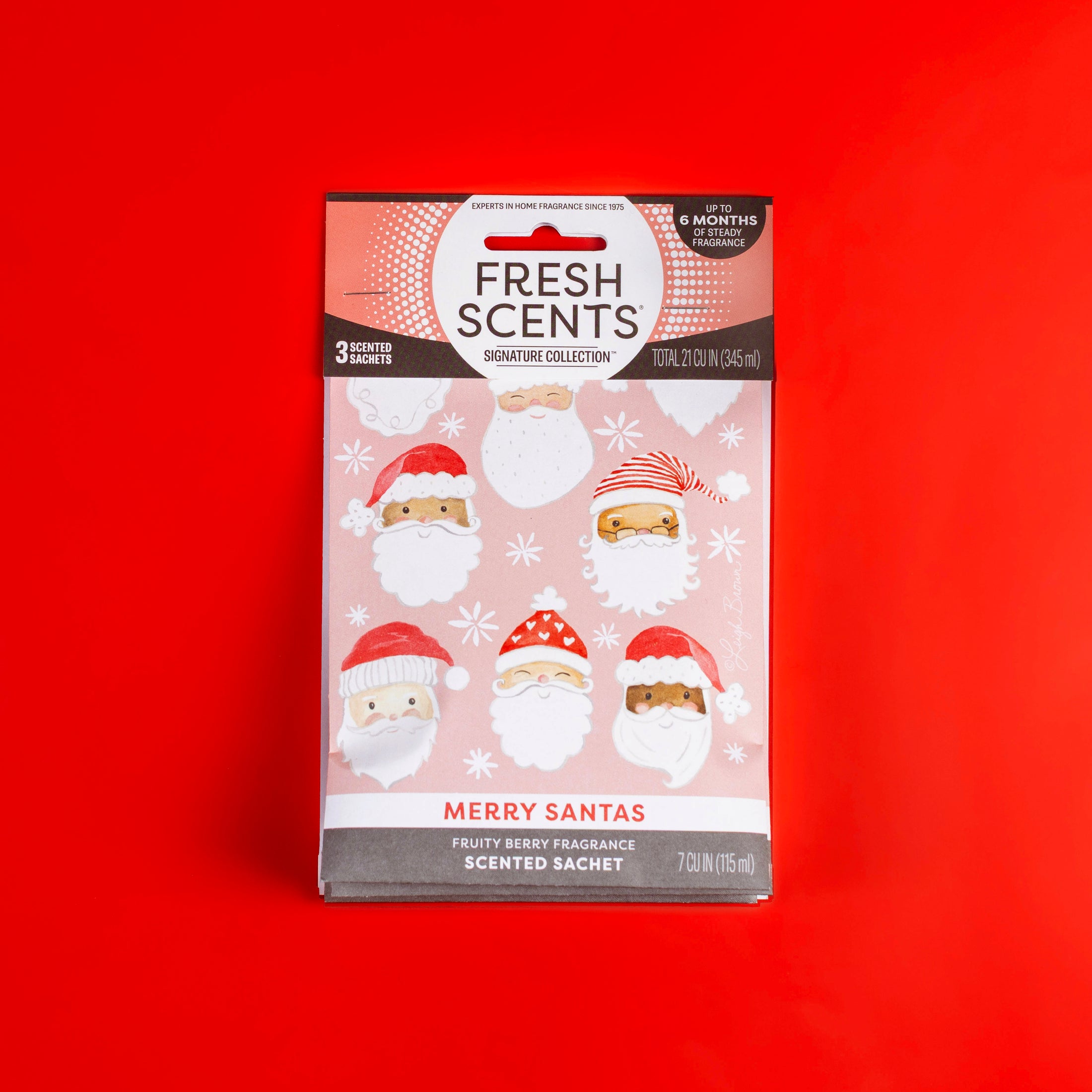 The Fresh Scents Merry Santas - Sachet 3pk features pink packs with Santa faces on red, delivering a fruity berry flameless fragrance—an ideal long-lasting air freshener for the season.