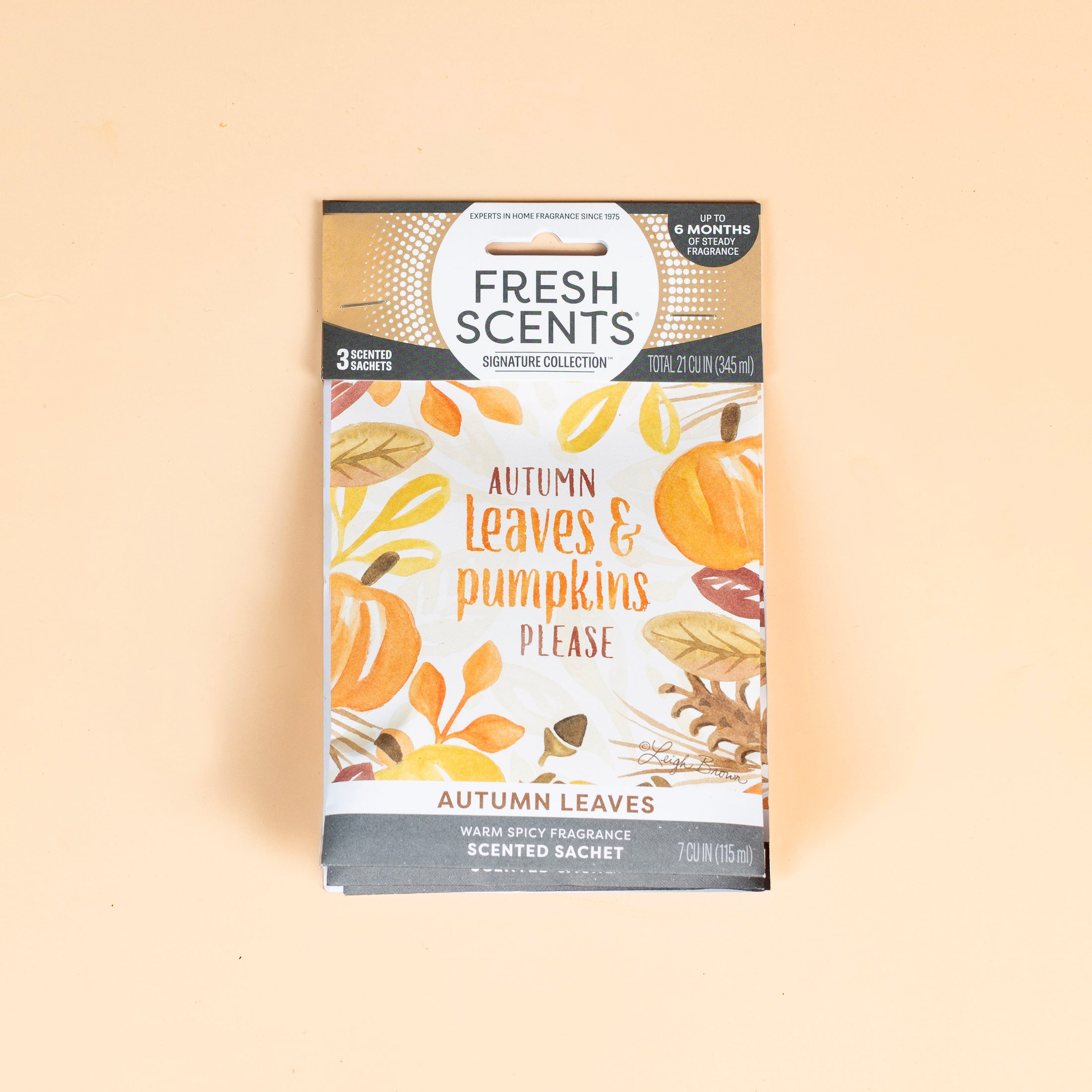 Fresh Scents Autumn Leaves - Sachet 3pk features autumn leaves and pumpkins on a light orange background. Enjoy long-lasting, flameless fragrance for your space with this scented sachet package.