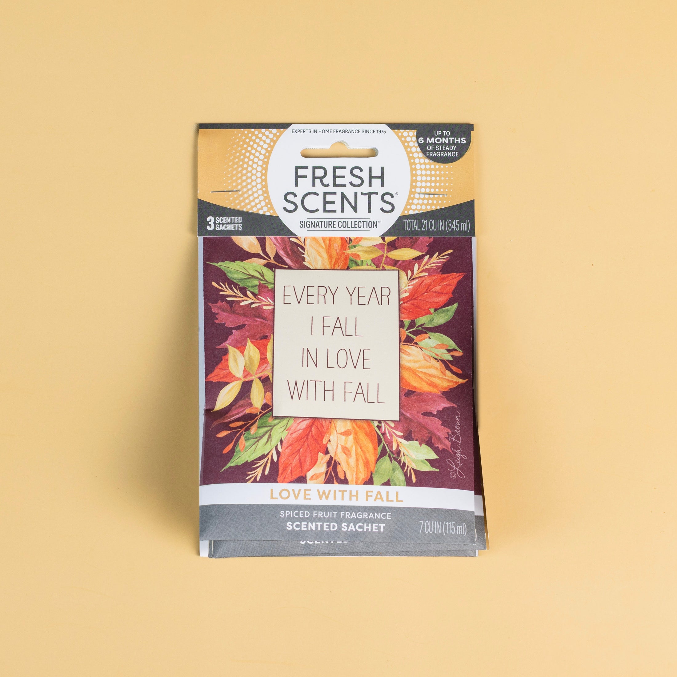 The Fresh Scents Love with Fall - Sachet 3pk features autumn leaves and "Every year I fall in love with fall" on the front, offering a perfect long-lasting flameless fragrance. Set against a plain beige background.