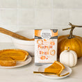 Load image into Gallery viewer, A slice of pumpkin pie sits near pumpkins and a mixing bowl, with a Fresh Scents "You're the Pumpkin - Sachet 3pk" box—perfect for adding long-lasting fragrance using flameless air freshener sachets.
