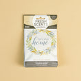 Load image into Gallery viewer, The Fresh Scents Lets Stay Home - Sachet 3pk features a floral wreath design with "let's stay home" on the front—an ideal flameless air freshener that offers long-lasting fragrance, shown here on a plain beige background.

