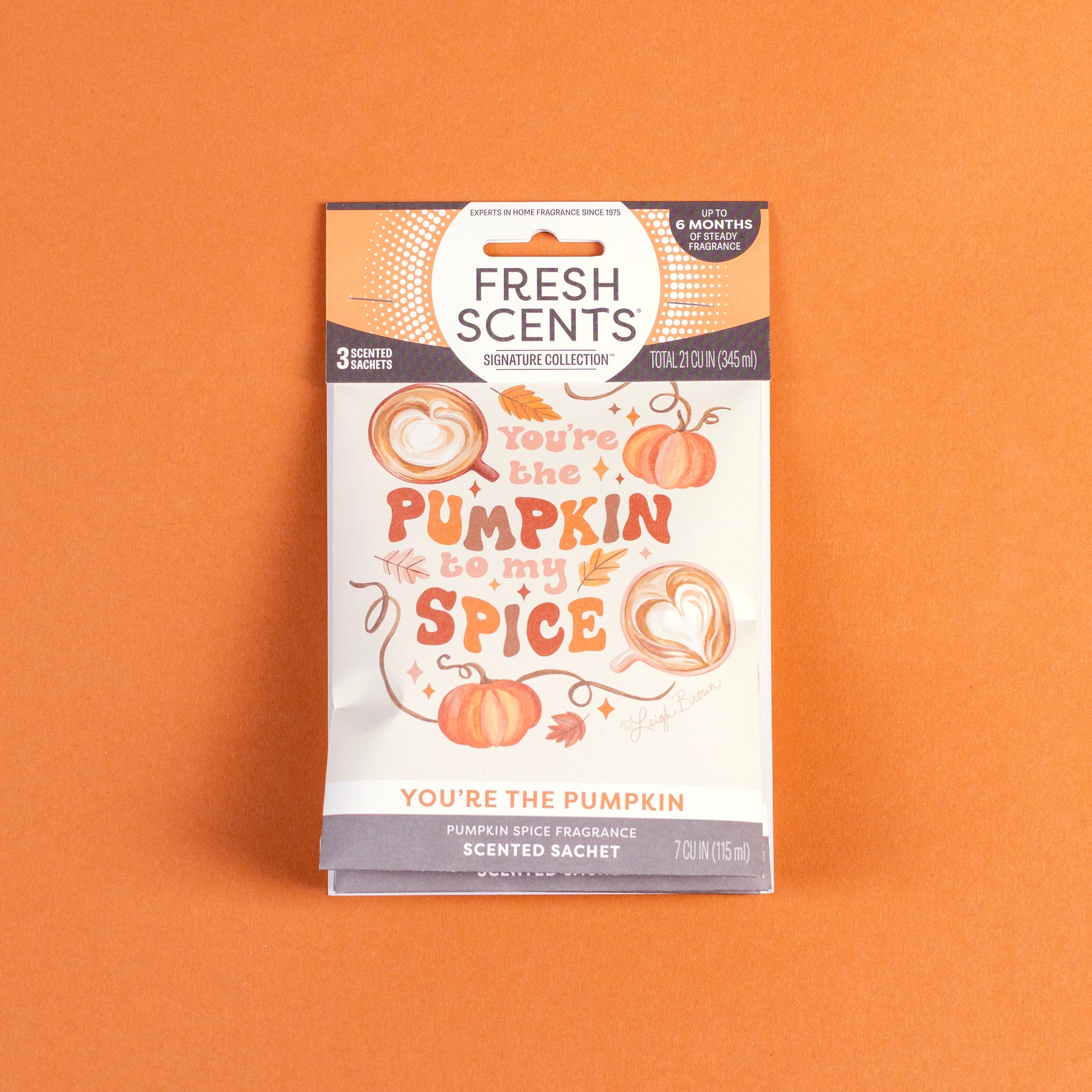 A 3-pack of "You’re the Pumpkin" scented sachets by Fresh Scents sits on an orange background, featuring pumpkin illustrations and offering a flameless, long-lasting pumpkin spice fragrance.