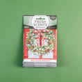 Load image into Gallery viewer, Fresh Scents Red Door Wreath - Sachet 3pk provides flameless, long-lasting spiced fruit fragrance. The package shows a holiday wreath with red plaid bow on a green background for a festive touch.
