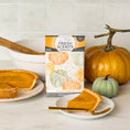 Load image into Gallery viewer, A Fresh Scents Spiced Pumpkin - Sachet 3pk is shown on a kitchen counter with pumpkin décor and pie, adding long-lasting, flameless fragrance to your home.
