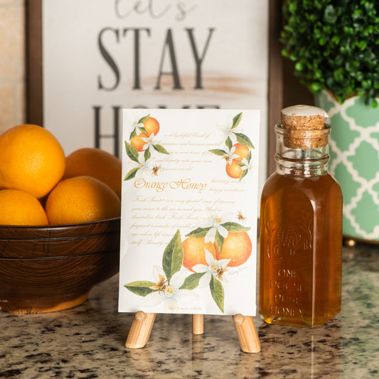 Orange & Honey Scented Sachet on Easel on Kitchen Counter with Jar of Honey