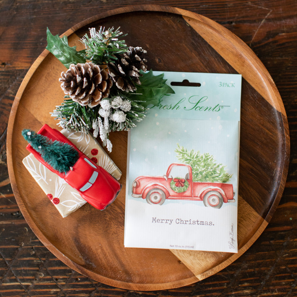Merry Christmas Fresh Scents Scented Sachet on wooden tray with red toy truck and pine cones
