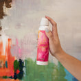 Load image into Gallery viewer, Hello Gorgeous Scented Room Spray Held in Hand Against Painted Pattern Background
