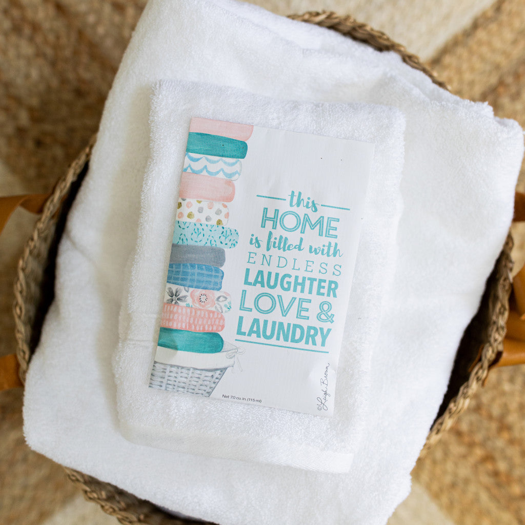 Laughter Love Laundry Fragrance Sachet on Stack of Towels