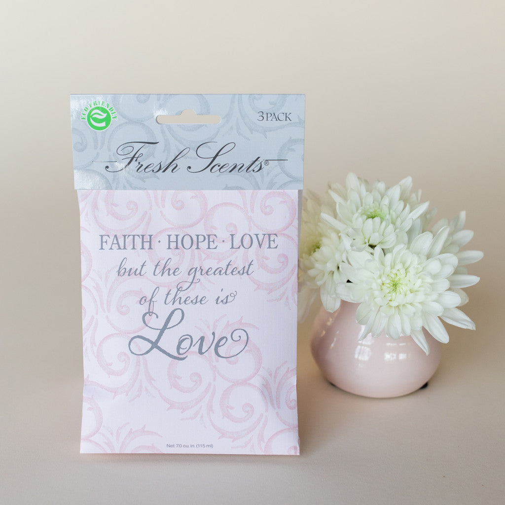 Faith Hope Love Scented Sachet Next to Potted Flowers