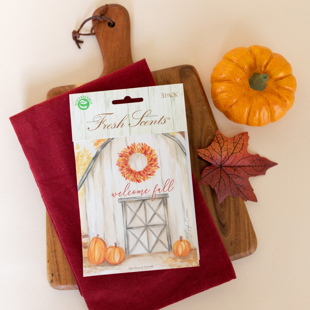 Welcome Fall Fresh Scents 3pk fall scented sachet on cutting board with pumpkin