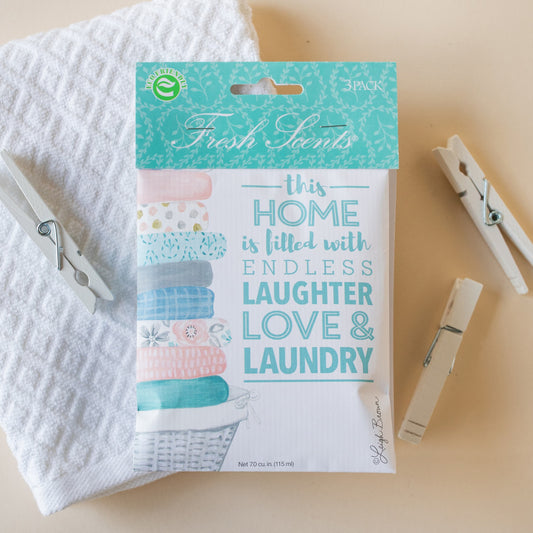 Laugh Love Laundry Clean Scented Sachet Flat Lay with Towel and Clothes Pins