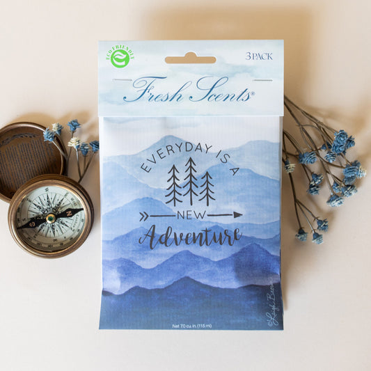 Adventure Mountain Fragrance Sachet Flat Lay with Wildflower and Compass